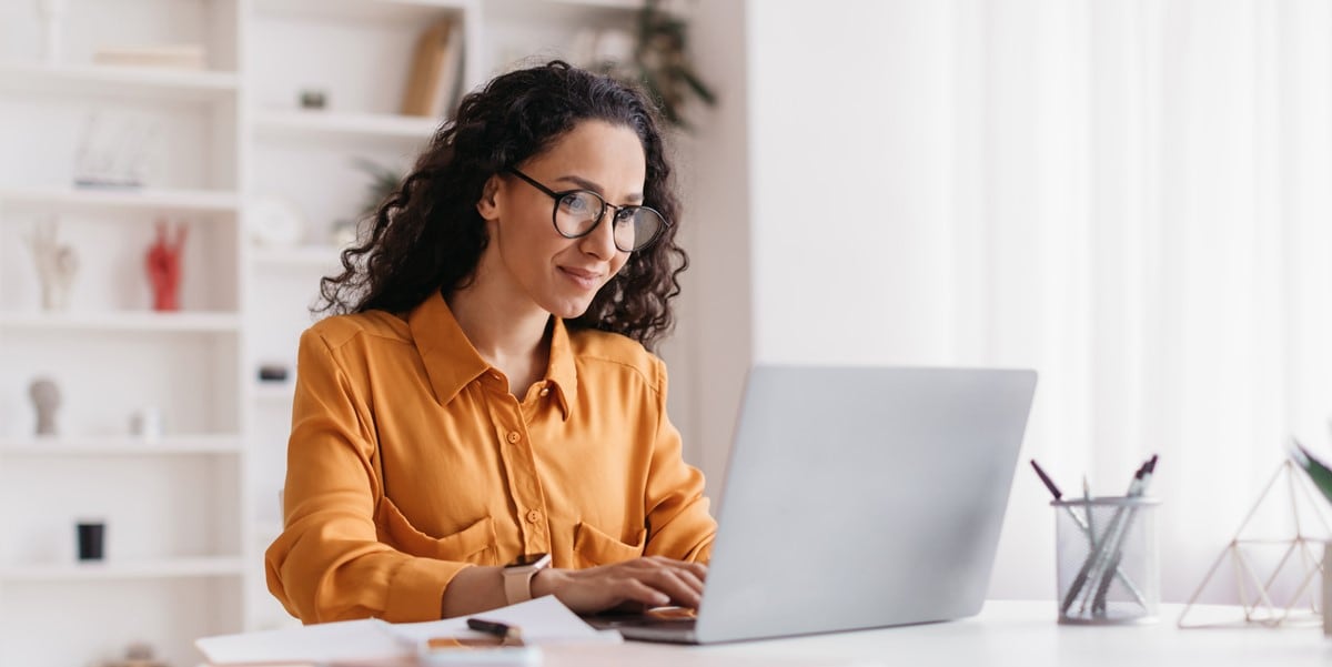 woman working at desk from home